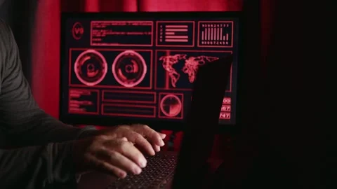 Gamer plays then gets up from computer. Dimly lit scene red graphics on monitor. Stock Footage 317940505