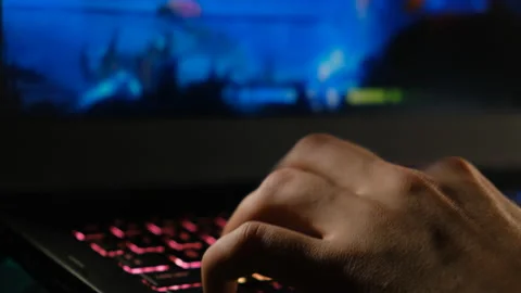 Gamer plays a video game on a computer, close-up Video stock 232622657