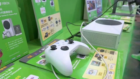 A gamer plays a videogame using a controller from the American video Stock Footage 210055510