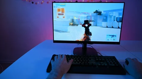 Gamer point of view when playing video game on pc with violent content Stock Footage 100795755