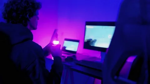 Gamer team playing virtual reality AI video games inside gaming room - Metaverse Stock Footage 231805855