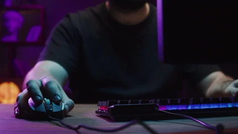 Gamer typing on backlight keyboard close-up, man playing video game. Male hands Stock Footage 172269895