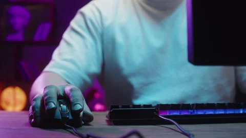 Gamer typing on backlight keyboard close-up, man playing video game. Male hands Stock Footage 172270065