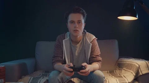 Gamers emotions with remote gaming console Stock Footage 82351679
