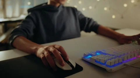 Gamer's Hand on a Computer Mouse During an Online Video Game Stock Footage 336316958