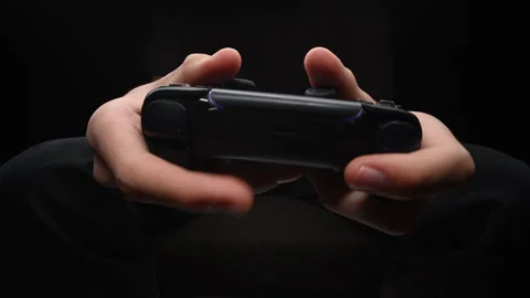 Gamers hands holding controller, focusing on joystick and gaming action Stock Footage 319144710