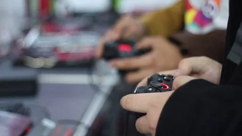 Gamers playing on the console using gamepads Stock Footage 73011423