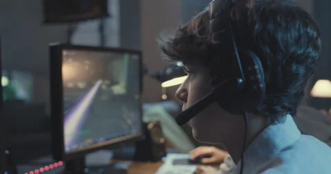 Gamers playing FPS games together at home Stock Footage 168253347
