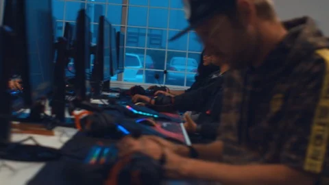 Gamers Playing Games in Esports Cafe Stock Footage