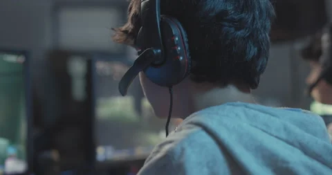Gamers playing multiplayer video games online Stock Footage 168247492