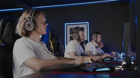 Gamers team plays a video game on PC at computer club, cyber sport tournament. E Stockbeeldmateriaal 266397876