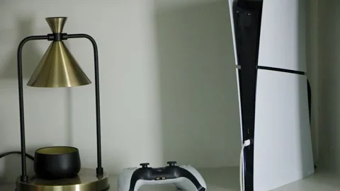 Gaming Console and Controller in Modern Home Entertainment Setup Stock Footage 342754592
