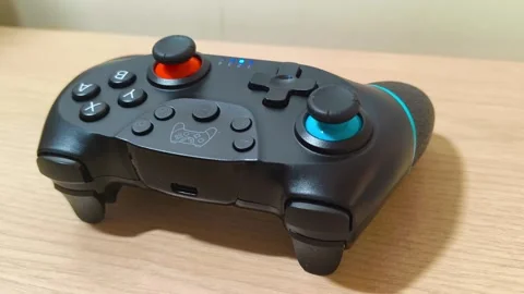 Gaming controller poised for action, ready for intense gameplay, bringing Video stock 318310887