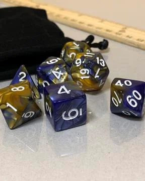 Gaming dice on a reflective surface Foto stock