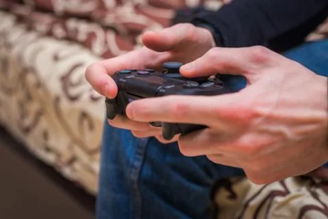 Gaming game play tv fun gamer gamepad guy controller video console playing pl Stock Photos