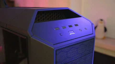 Gaming pc case with perforated front panel. Sloping top panel with power button Stock Footage 228653353