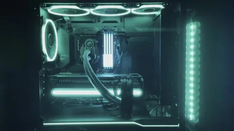 Gaming Pc Glowing Turquoise In The Dark - The System Unit Of A Modern Computer Stock Footage 242395037