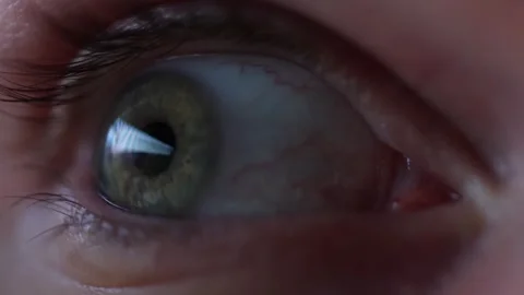 Gaming reflection in eye suggesting addiction Stock Footage 329586515