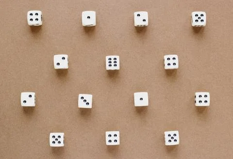 Gaming white dice pattern on brown background in flat lay style. Concept with Stock Photos