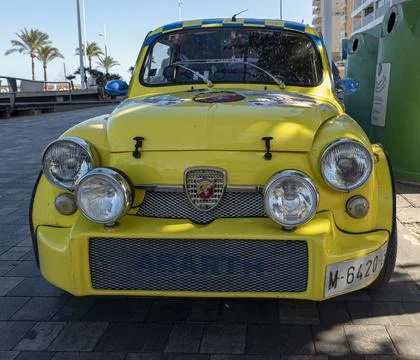 Gandia, Spain - September 19, 2026. Bright yellow Fiat Abarth classic car w.. Stock Photos