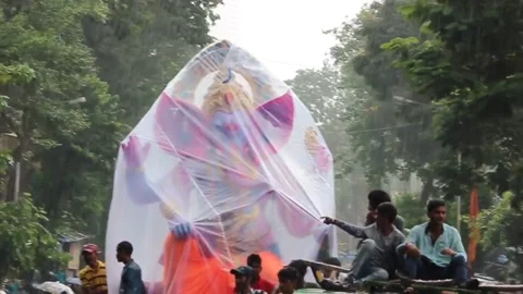 Ganesha going to immersion in water during rainy season Stock Footage 132885609