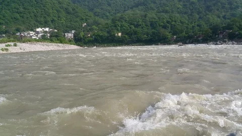 Ganga/ Ganges river flows through Rishikesh town, India Stock Footage 114343347