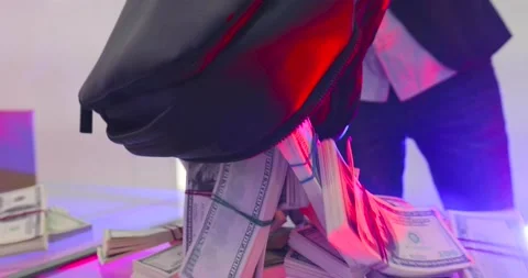 Gangster emptying a bag of bills on the table Stock-Footage 155456341