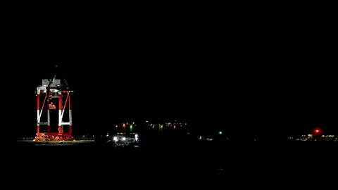 Gantry Crane Lit Up at Night on Coast Background Copy Space,4K Stock Footage 346166380