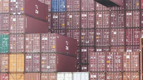 Gantry crane loading 40 feet container to ship 4k Stock Footage 90137722