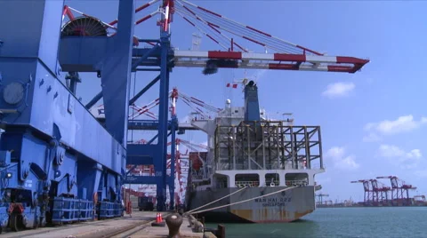A gantry crane is loading and unloading ... | Stock Video | Pond5