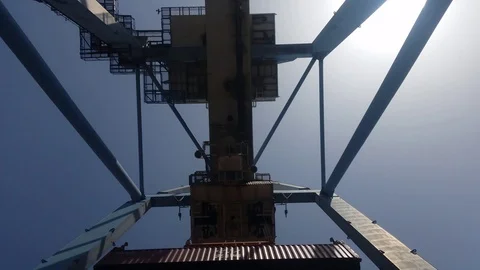 Gantry crane unloading container - bottom view  Stock Footage 88850635
