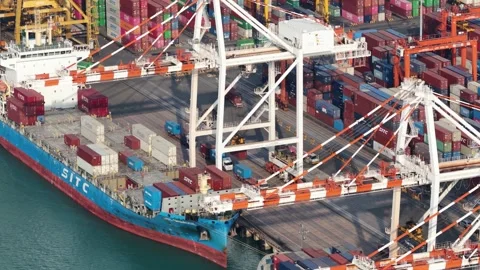 Gantry cranes loading cargo container ship at port Stock Footage 333656098