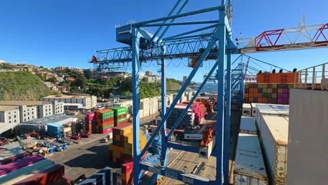 Gantry cranes unload containers from ship deck at Port of Valparaiso, Chile Stock Footage 347079027