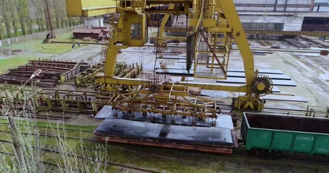 Gantry electromagnetic crane. Electromagnetic crane on steel yard Stock Footage 317100202