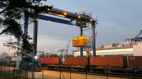 Gantry Loading Container on Freight Train in the Evening 動画素材 98773372