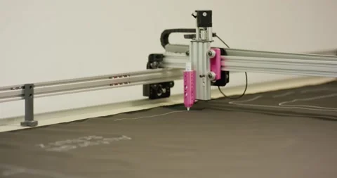 Gantry Marking Machine Drawing Cut Lines on Dark Fabric, Wide Shot Stock Footage 341315010