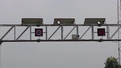 A gantry structure supporting what appear to be traffic cameras Stock Footage 314522309
