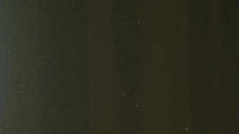 The gap between the green curtains lets in sunlight, which illuminates the du Stock Footage 150188798