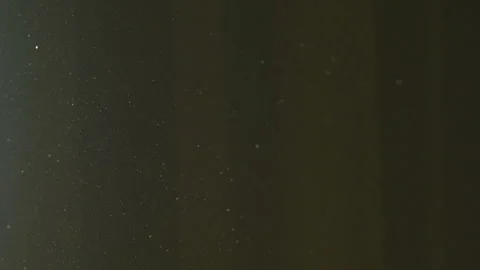 The gap between the green curtains lets in sunlight, which illuminates the du Stock Footage 150188800