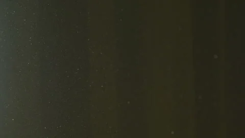 The gap between the green curtains lets in sunlight, which illuminates the du Stock Footage 150188808