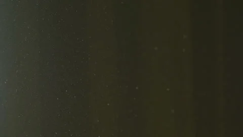 The gap between the green curtains lets in sunlight, which illuminates the du Stock Footage 150188816