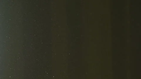 The gap between the green curtains lets in sunlight, which illuminates the du Stock Footage 150188825