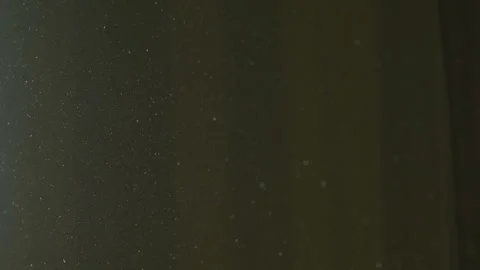 The gap between the green curtains lets in sunlight, which illuminates the du Stock Footage 150188834