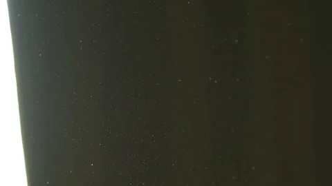 The gap between the green curtains lets in sunlight, which illuminates the du Stock Footage 150188845