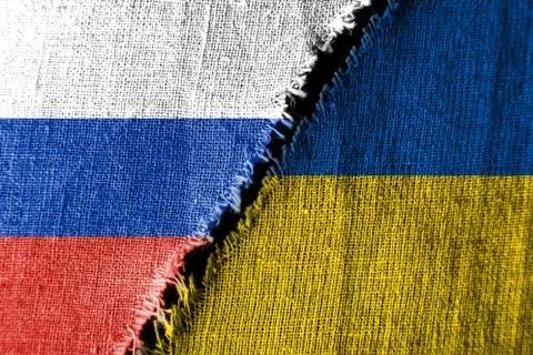 The gap between the two flags, Russia  and Ukraine, sewn with threads, as the Stock Photos