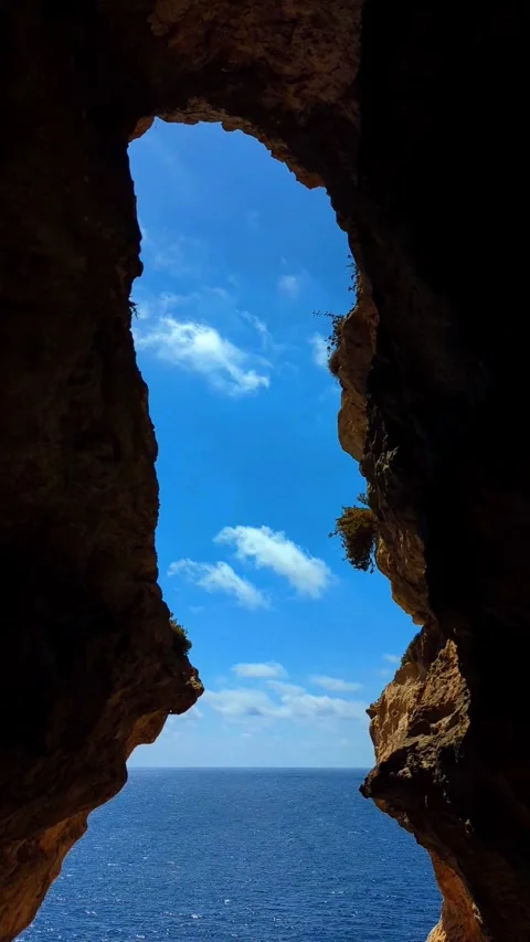 Għar ir-Riħ Cave Timelapse with Moving Clouds, Malta Coast Stock Footage 332151751