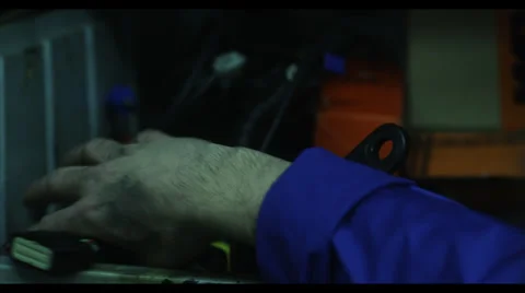 GARAGE - CHECKING CABLES (SLOW MOTION) Stock Footage 29986809