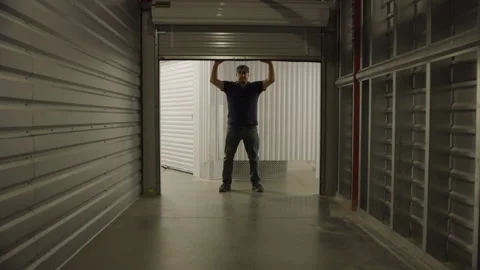 Garage door open and close self storage facility Stock Footage 249298101