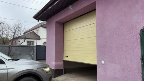 Garage Door opening automatically when car arriving home, geofence trigger. Stock Footage 346721836