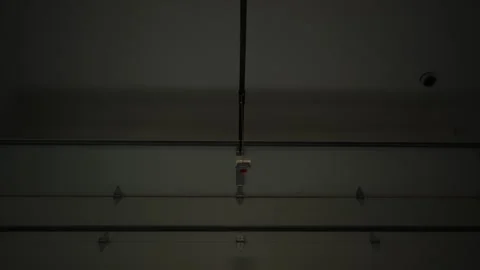 Garage Door Opening Move Up. Inside view in garage shot footage Stock Footage 295970087